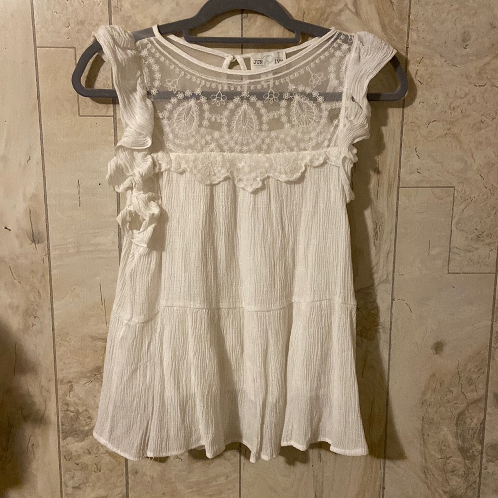 Shirt from Francesca’s. White with lace and ruffle detailing. Size large.